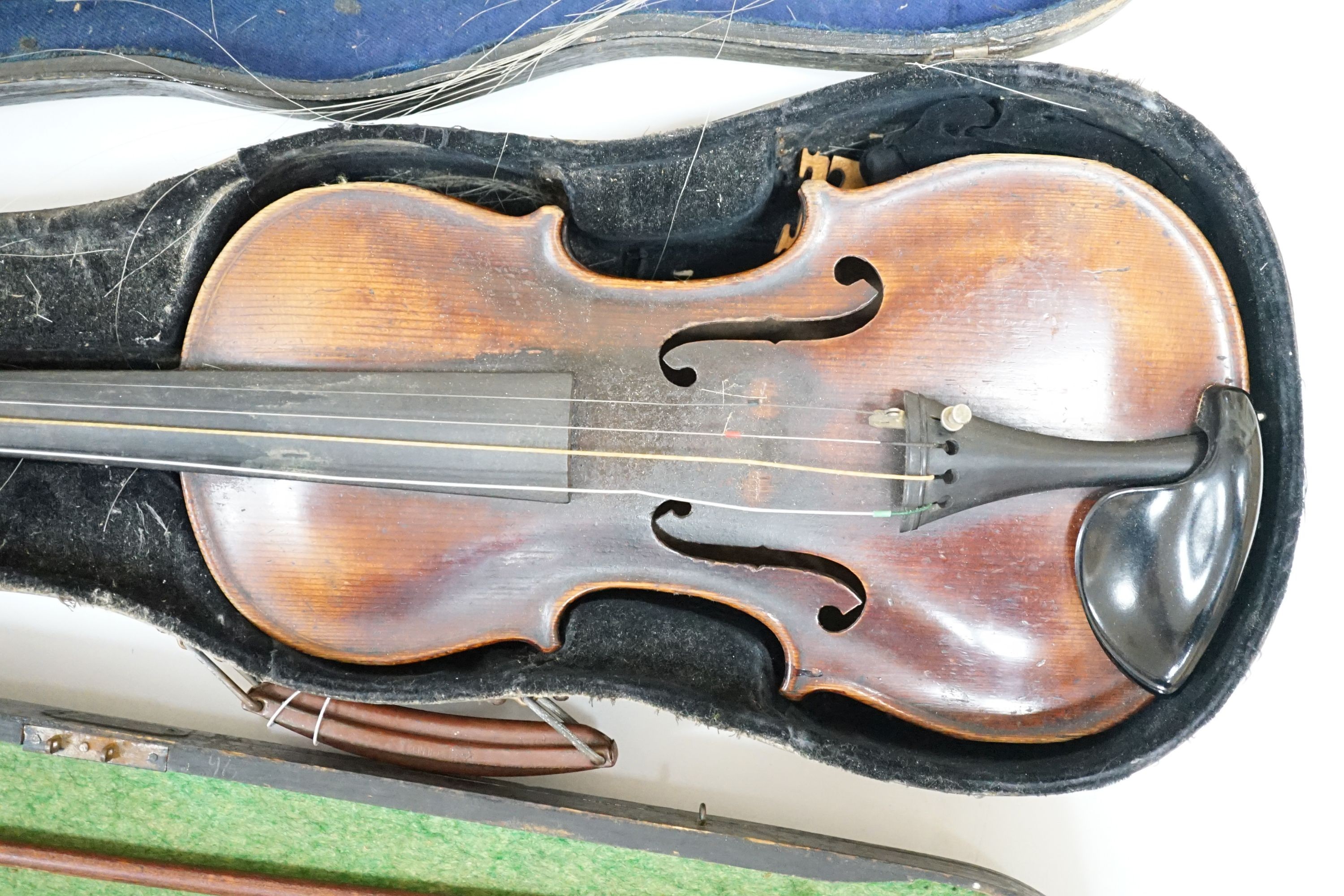 A 19th century 3/4 size violin, cased with 2 bows and 1 other German violin